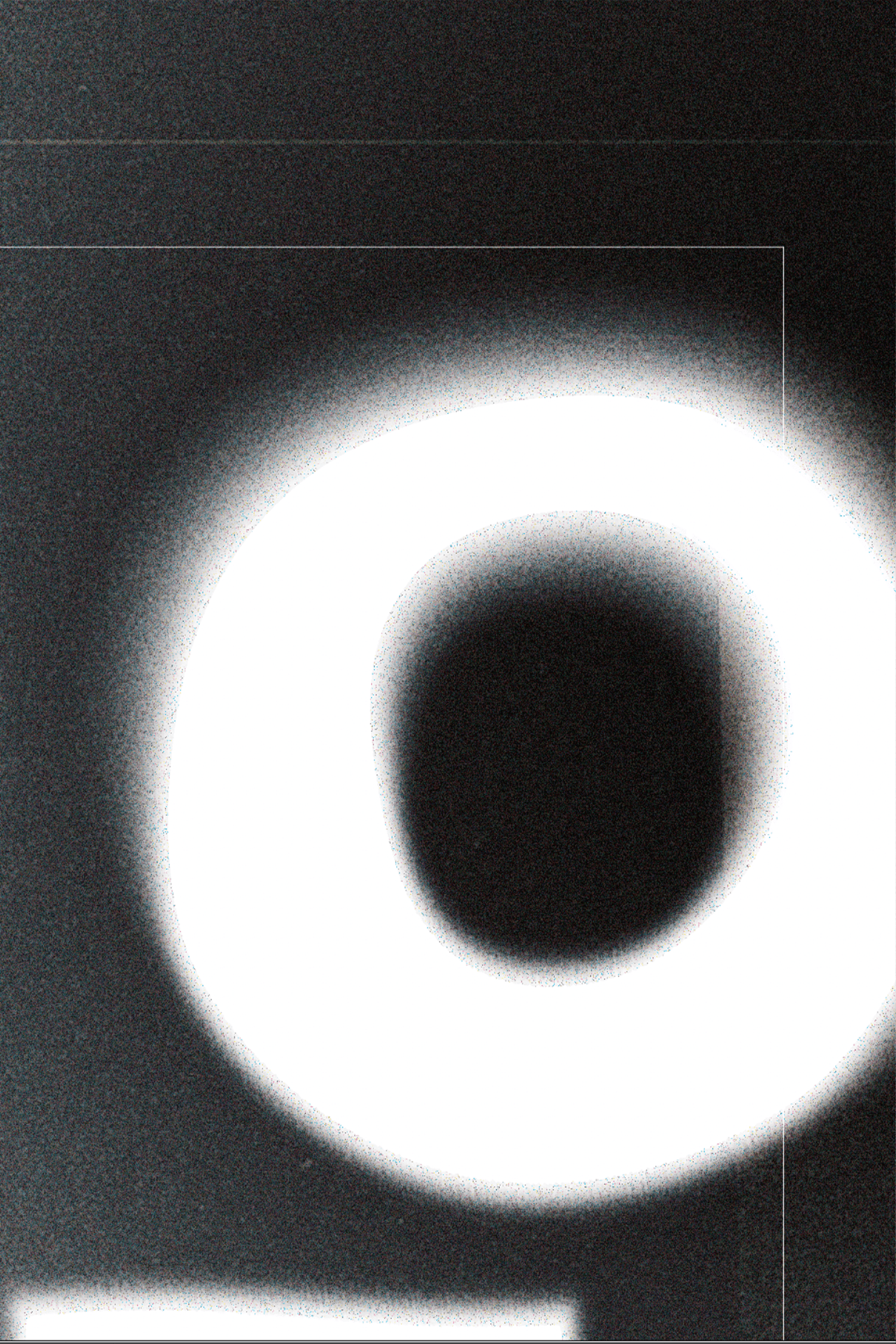 Detail of the third poster: a soft blurred letter O in white on black