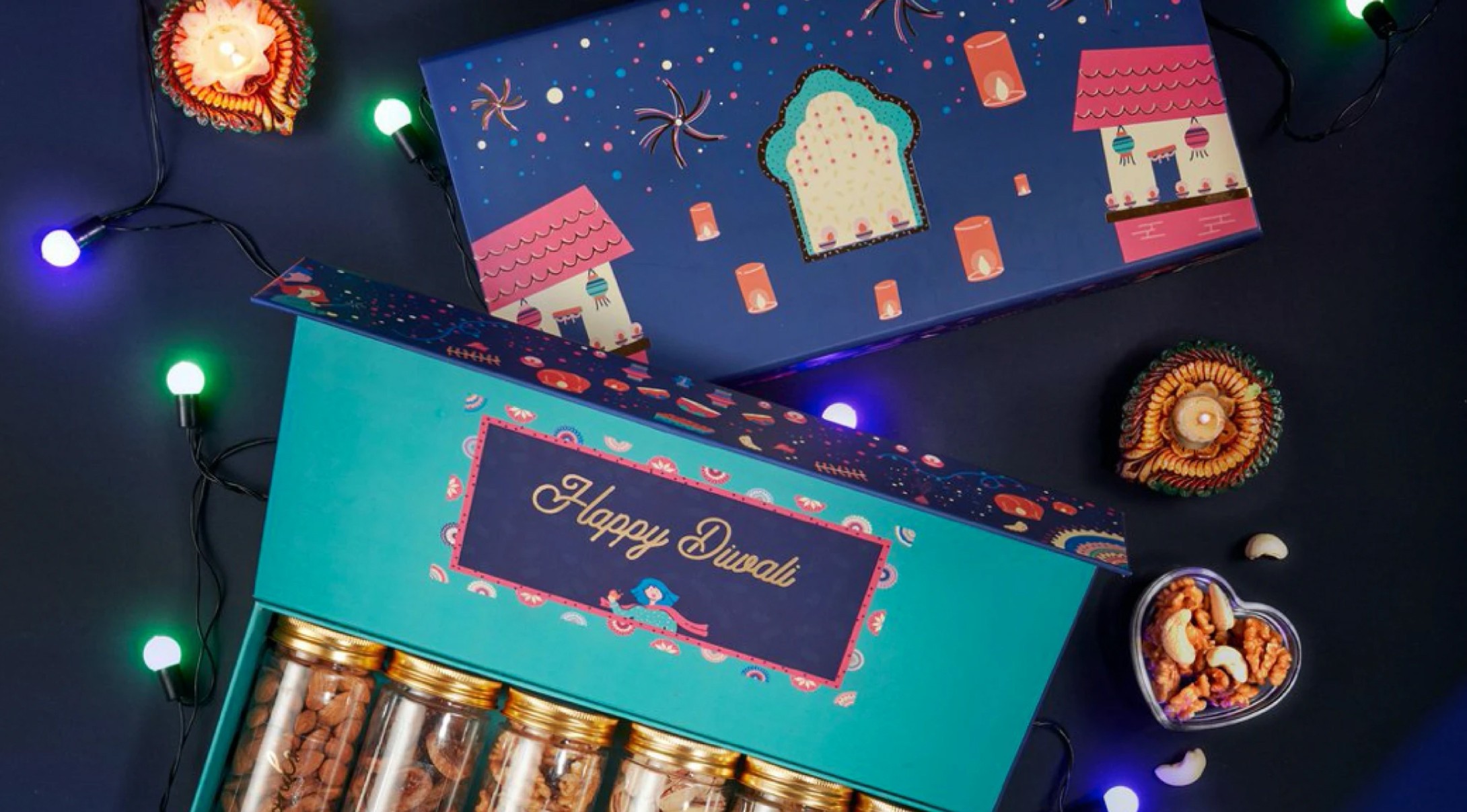 Happy Diwali packaging for Native Picks premium dry fruits, surrounded by fairy lights and clay lamps