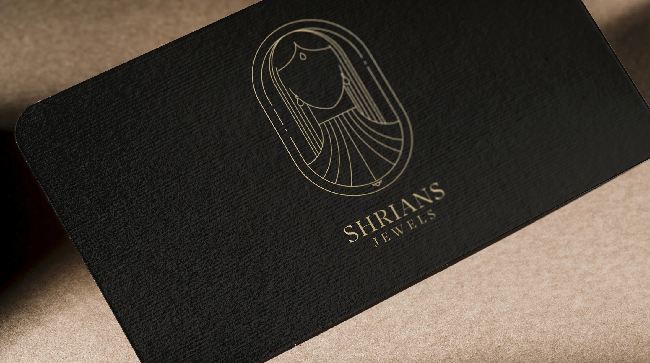 Black Shrians Jewels business card with a gold foil logo