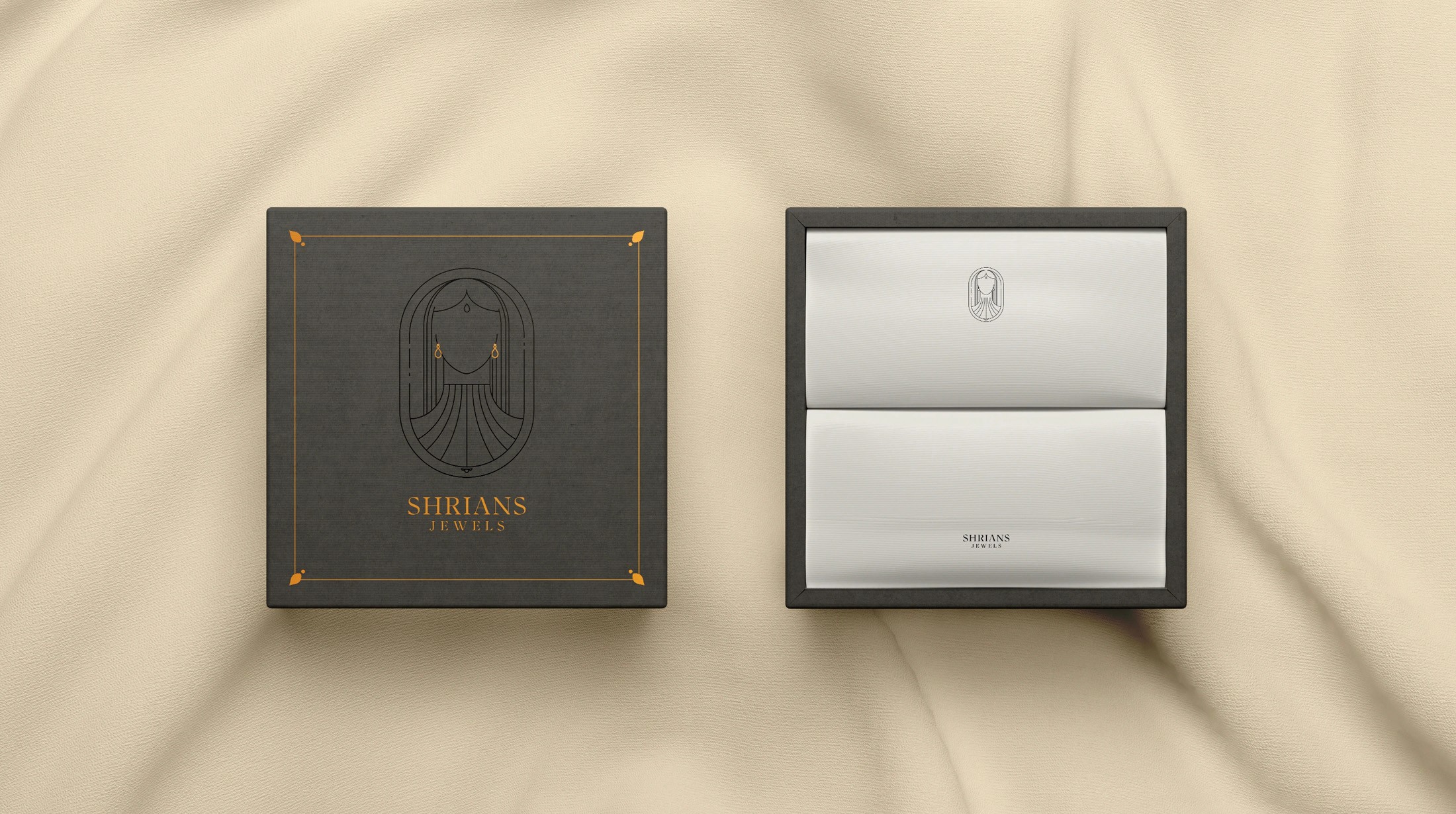 Shrians Jewels black jewellery box and white gift box on cream silk