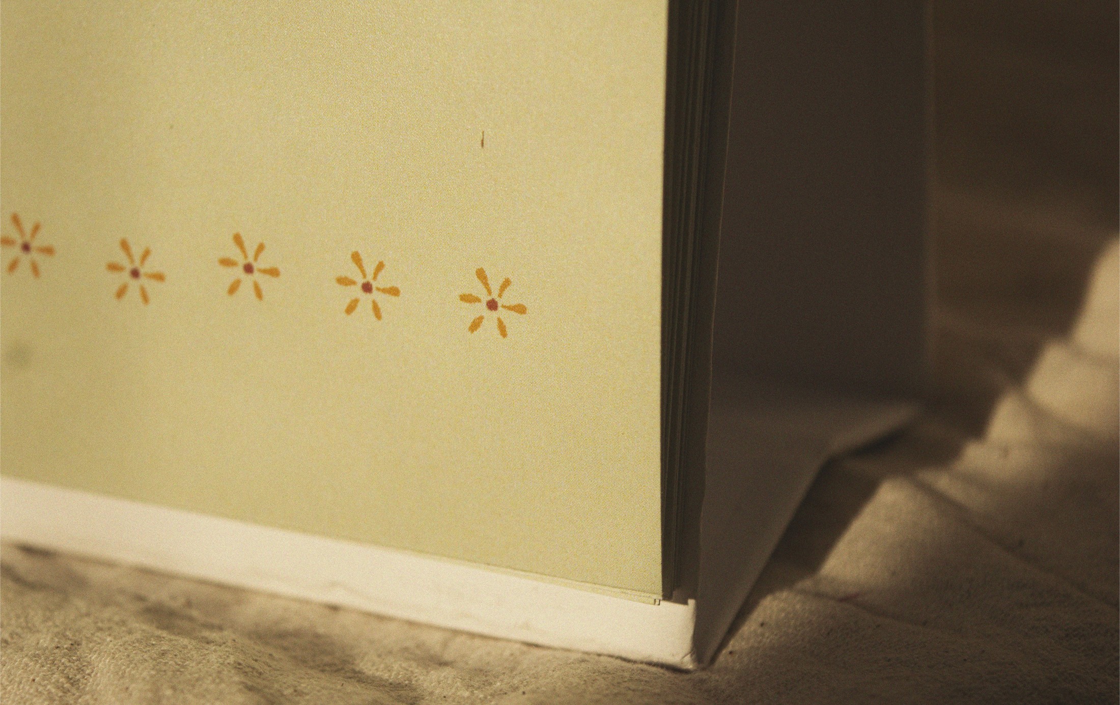 Close-up of the hand-drawn flower border at the base of the calendar